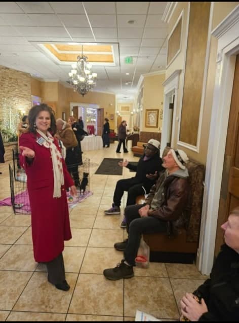 NWI Fun Ball attendees in a lobby with decorative lighting